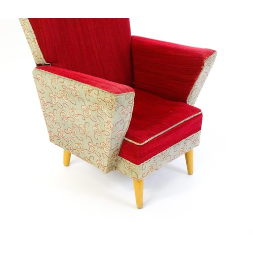 1463 - Vintage / Retro: An upholstered child's chair raised on four turned tapering legs. 22