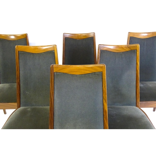 1465 - Vintage / Retro: A set of six teak G plan dining chairs, with a shaped top rail, upholstered backres... 