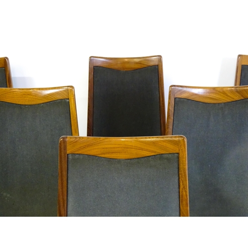 1465 - Vintage / Retro: A set of six teak G plan dining chairs, with a shaped top rail, upholstered backres... 