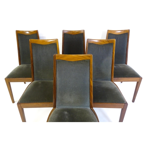 1465 - Vintage / Retro: A set of six teak G plan dining chairs, with a shaped top rail, upholstered backres... 