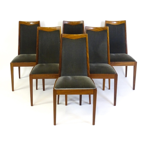 1465 - Vintage / Retro: A set of six teak G plan dining chairs, with a shaped top rail, upholstered backres... 