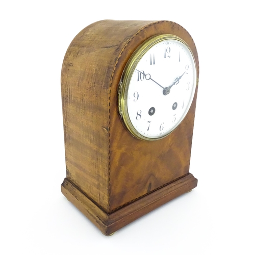 1292 - A 19thC arch top mantel clock, the flame mahogany case with boxwood and ebony stringing, enamelled d... 