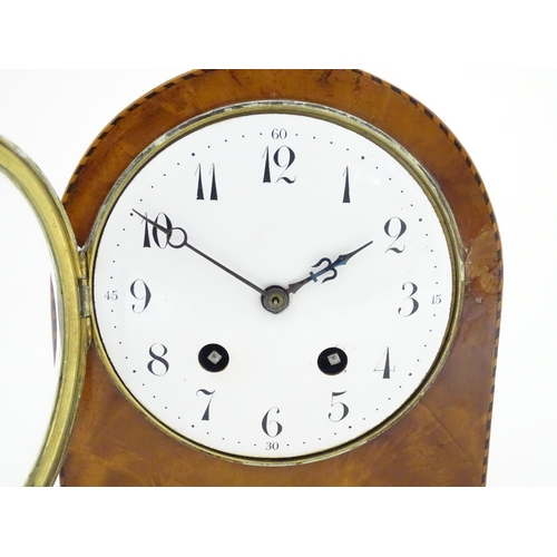 1292 - A 19thC arch top mantel clock, the flame mahogany case with boxwood and ebony stringing, enamelled d... 