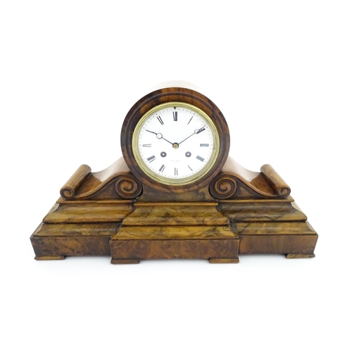 1294 - A French 8-day mantle clock striking on a bell in walnut case and with white enamel dial and movemen... 