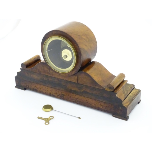 1294 - A French 8-day mantle clock striking on a bell in walnut case and with white enamel dial and movemen... 