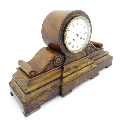 1294 - A French 8-day mantle clock striking on a bell in walnut case and with white enamel dial and movemen... 