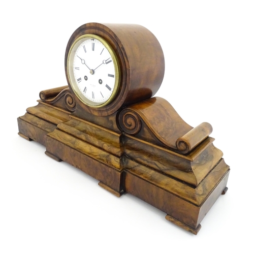 1294 - A French 8-day mantle clock striking on a bell in walnut case and with white enamel dial and movemen... 