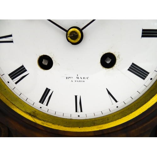 1294 - A French 8-day mantle clock striking on a bell in walnut case and with white enamel dial and movemen... 