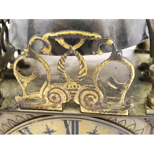 1295 - A 20thC brass cased lantern clock, the movement marked Empire. Approx 10