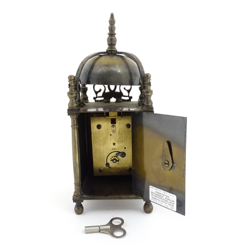 1295 - A 20thC brass cased lantern clock, the movement marked Empire. Approx 10