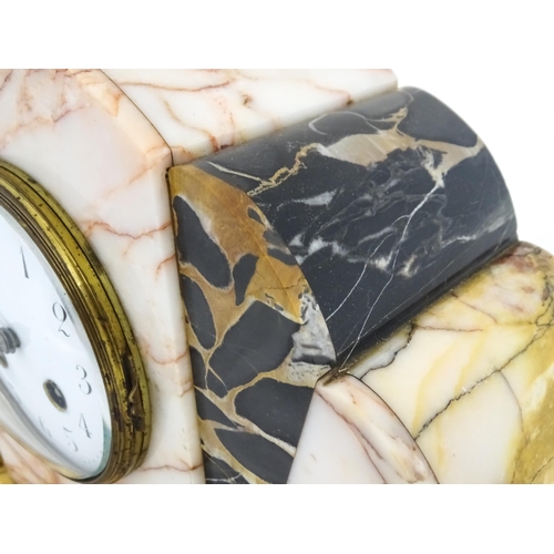 1303 - A French Art Deco marble cased clock and garnitures. The clock with white enamel dial, the 8-day mov... 