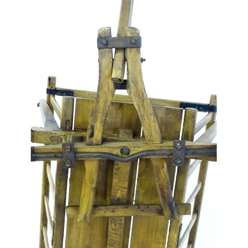 1321 - A 19thC wooden dog cart / hand cart with four wheels. Approx 47