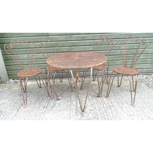 1322 - Mid 20thC wrought iron bistro / garden / patio furniture, comprising four chairs and circular table ... 