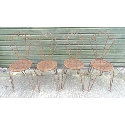 1322 - Mid 20thC wrought iron bistro / garden / patio furniture, comprising four chairs and circular table ... 