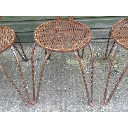 1322 - Mid 20thC wrought iron bistro / garden / patio furniture, comprising four chairs and circular table ... 