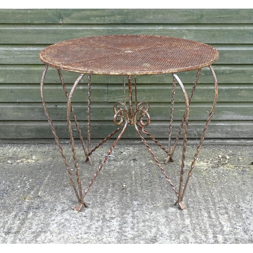 1322 - Mid 20thC wrought iron bistro / garden / patio furniture, comprising four chairs and circular table ... 