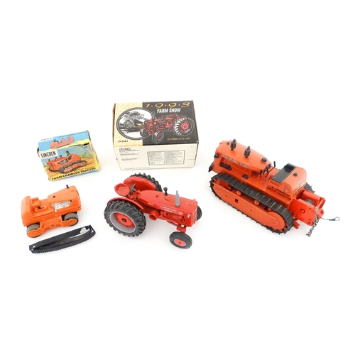 853 - Toys: Three assorted die cast and plastic scale model farm vehicles comprising an Ertl International... 