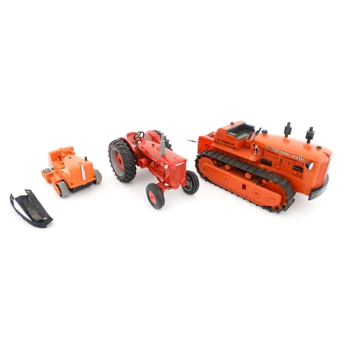 853 - Toys: Three assorted die cast and plastic scale model farm vehicles comprising an Ertl International... 