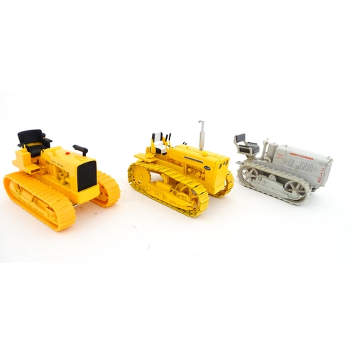 854 - Toys: An Ertl scale model John Deere 1010 Crawler Tractor in yellow, and an Ertl Caterpillar Tractor... 