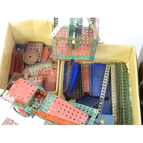 856 - Toys: A large quantity of assorted Meccano to include flat plates, girders, wheels, various instruct... 