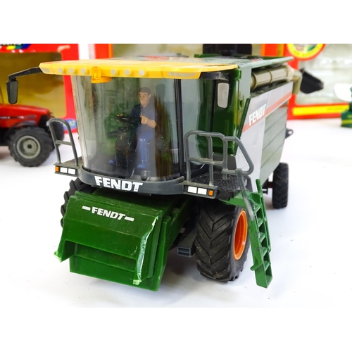 857 - Toys: A quantity of assorted Britains farmyard die cast and plastic toys / models to include tractor... 