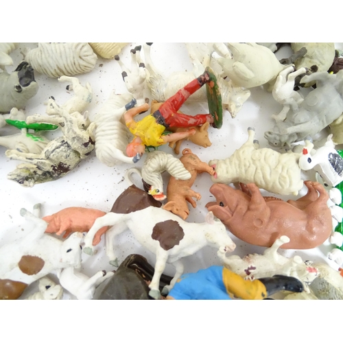 857 - Toys: A quantity of assorted Britains farmyard die cast and plastic toys / models to include tractor... 