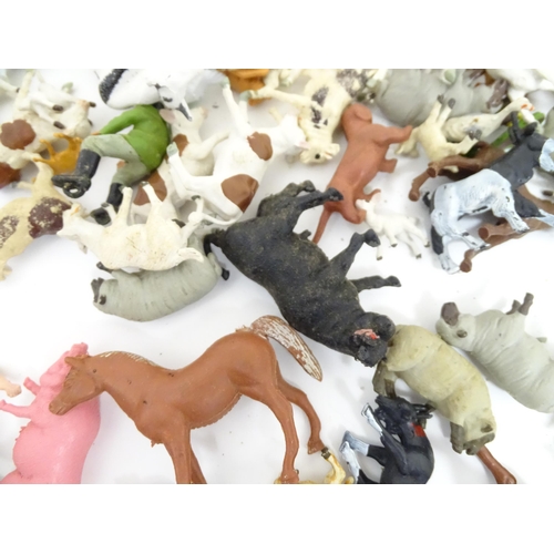 857 - Toys: A quantity of assorted Britains farmyard die cast and plastic toys / models to include tractor... 