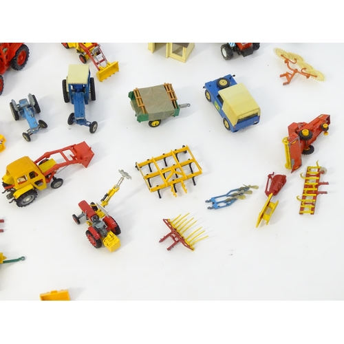 857 - Toys: A quantity of assorted Britains farmyard die cast and plastic toys / models to include tractor... 