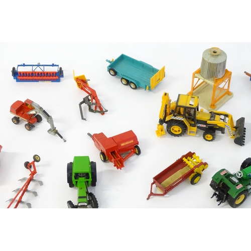 857 - Toys: A quantity of assorted Britains farmyard die cast and plastic toys / models to include tractor... 