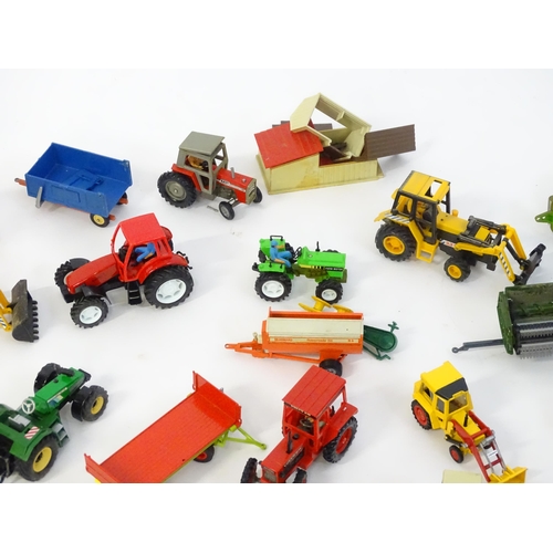 857 - Toys: A quantity of assorted Britains farmyard die cast and plastic toys / models to include tractor... 