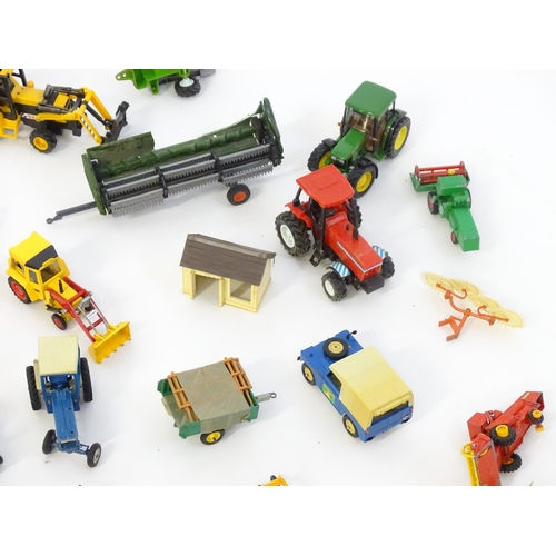 857 - Toys: A quantity of assorted Britains farmyard die cast and plastic toys / models to include tractor... 