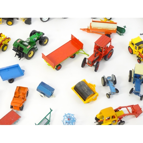 857 - Toys: A quantity of assorted Britains farmyard die cast and plastic toys / models to include tractor... 