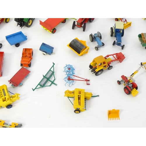 857 - Toys: A quantity of assorted Britains farmyard die cast and plastic toys / models to include tractor... 