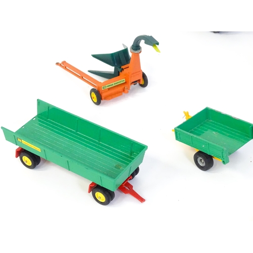 857 - Toys: A quantity of assorted Britains farmyard die cast and plastic toys / models to include tractor... 