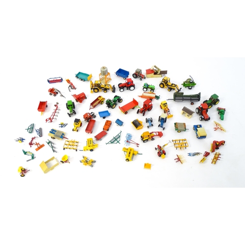 857 - Toys: A quantity of assorted Britains farmyard die cast and plastic toys / models to include tractor... 