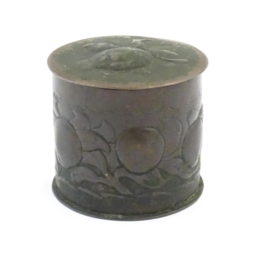 1004 - An Arts and crafts copper tea caddy with embossed fruit decoration. Marked Newlyn under. Approx. 4 1... 