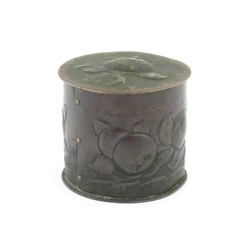 1004 - An Arts and crafts copper tea caddy with embossed fruit decoration. Marked Newlyn under. Approx. 4 1... 