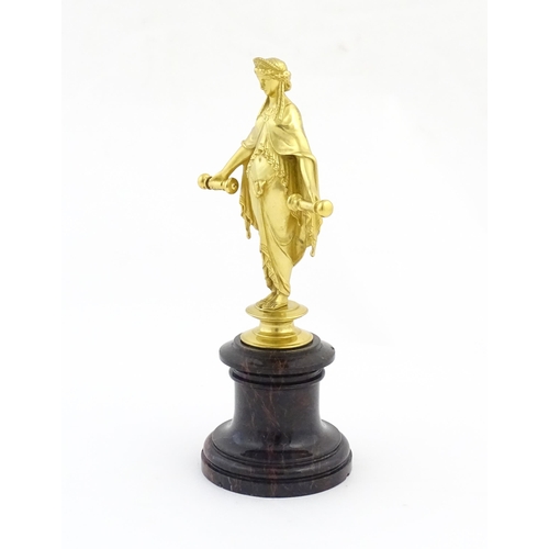 1013 - A late 19th / early 20thC Continental gilt bronze sculpture depicting an allegorical figure, possibl... 