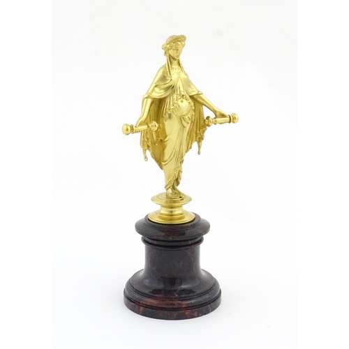 1013 - A late 19th / early 20thC Continental gilt bronze sculpture depicting an allegorical figure, possibl... 