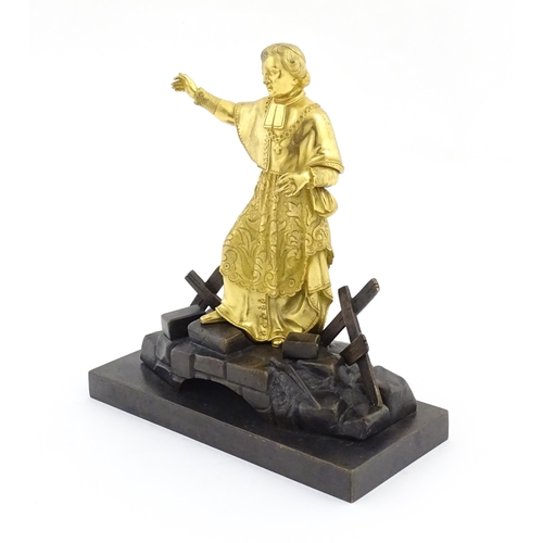 1015 - A late 19th / early 20thC Continental bronze sculpture depicting an ormolu Cardinal figure on a brid... 