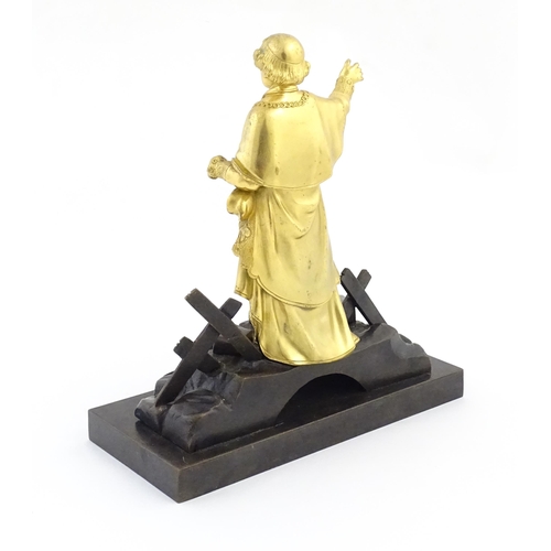 1015 - A late 19th / early 20thC Continental bronze sculpture depicting an ormolu Cardinal figure on a brid... 