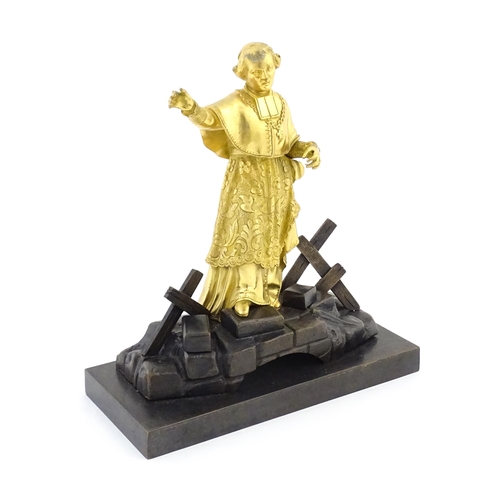 1015 - A late 19th / early 20thC Continental bronze sculpture depicting an ormolu Cardinal figure on a brid... 