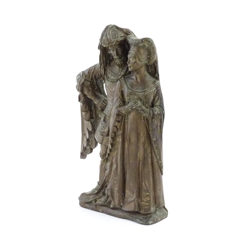 1018 - A 20thC cast doorstop / door porter depicting a medieval nobleman and woman, by D.H. Morton for Marc... 