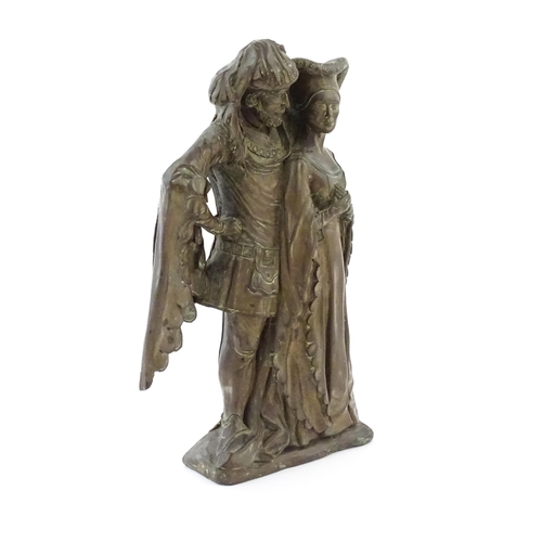 1018 - A 20thC cast doorstop / door porter depicting a medieval nobleman and woman, by D.H. Morton for Marc... 