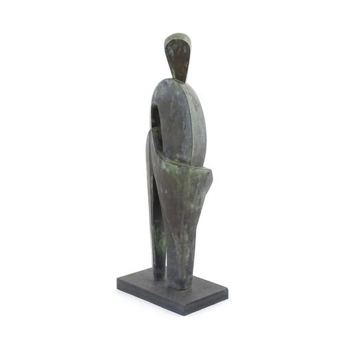 1020 - A 20thC cast bronze sculpture depicting a stylised standing figure. In the manner of JD Hansen. Appr... 