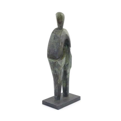 1020 - A 20thC cast bronze sculpture depicting a stylised standing figure. In the manner of JD Hansen. Appr... 