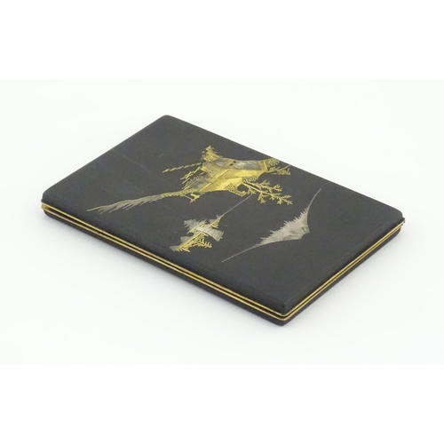 1034 - A Japanese cigarette case with Damascene decoration depicting a view of Mount Fuji. Approx. 4 3/4