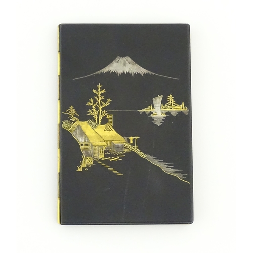 1034 - A Japanese cigarette case with Damascene decoration depicting a view of Mount Fuji. Approx. 4 3/4