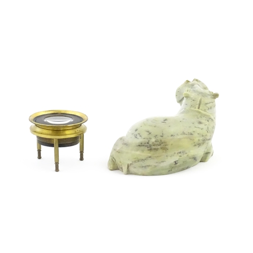 1035 - A 20thC soapstone model of a hippopotamus. Together with a thread counter / magnifier. Hippo approx.... 