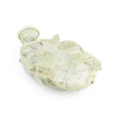 1035 - A 20thC soapstone model of a hippopotamus. Together with a thread counter / magnifier. Hippo approx.... 